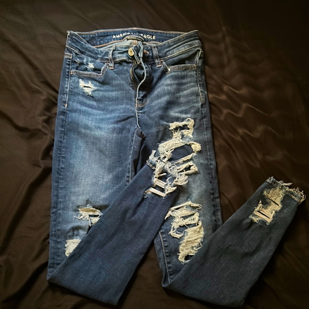 Jeans with rips in them but the holes are covered underneath!